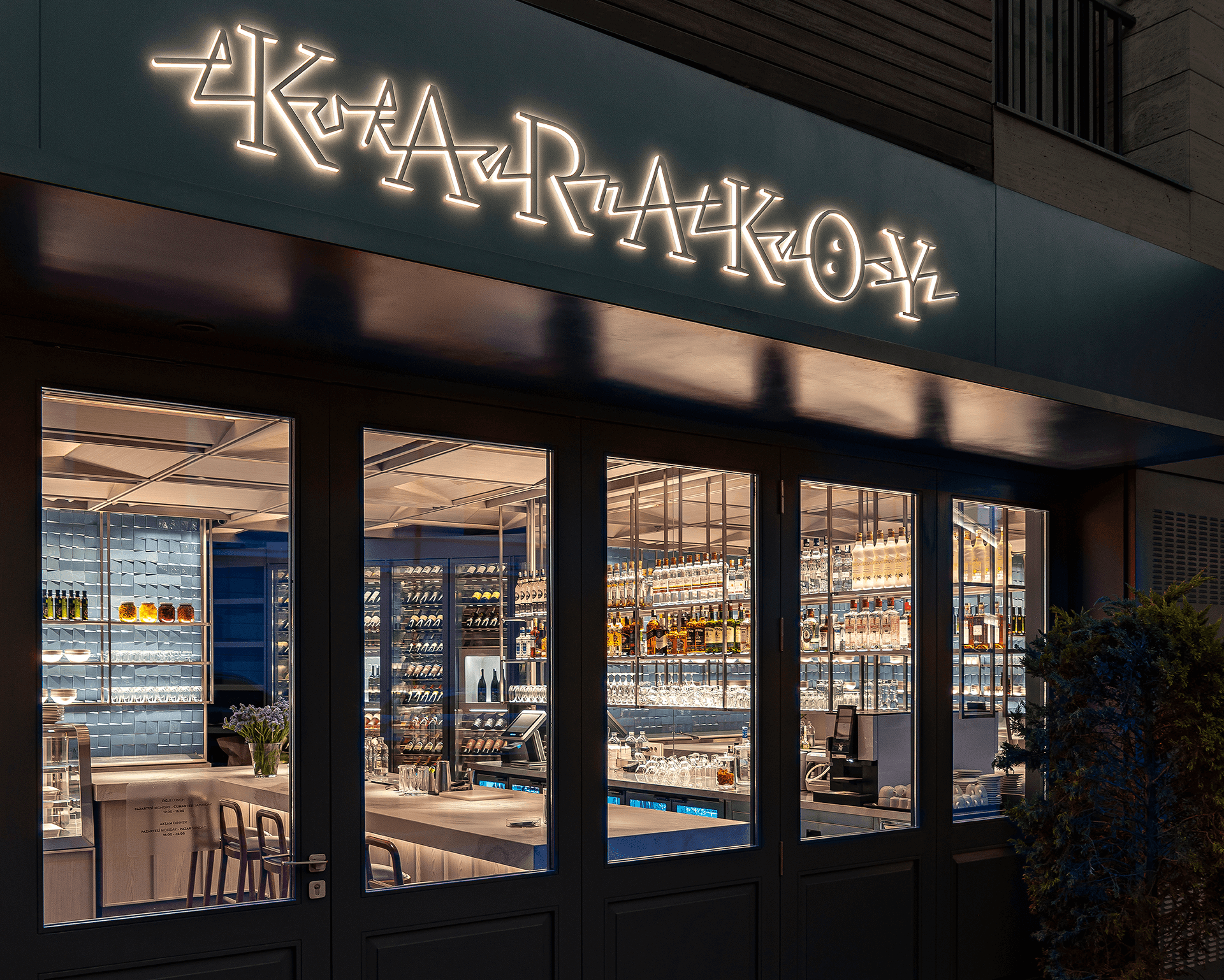 The illuminated entrance of Karaköy Lokantası with its blue-tiled interior